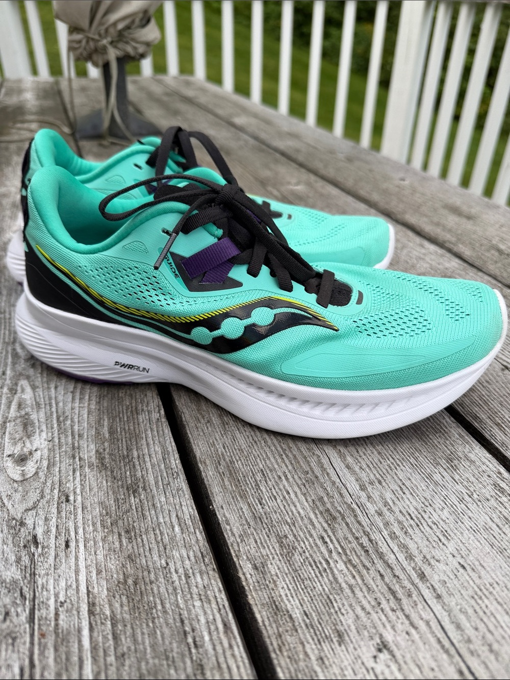 Saucony Women's Teal Running Shoes with Black and Purple Accents, size 9
